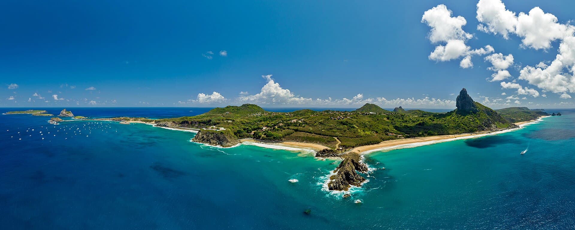 Marine National Park of Fernando de Noronha — turquoise Atlantic and the volcanic Dois Irmãos formation.