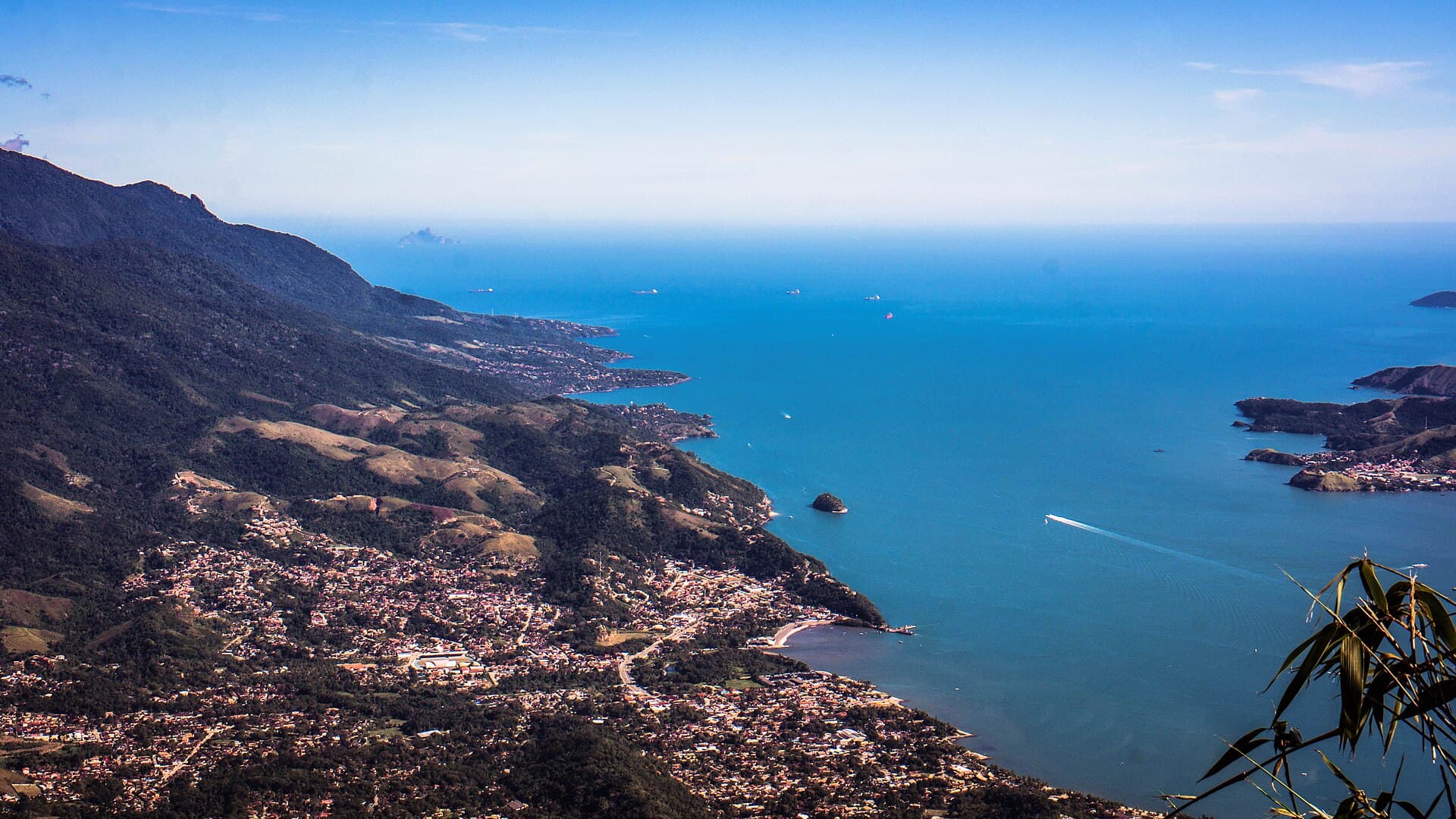 From Pico do Baepi — Ilhabela's forested mountains and the channel separating the island from the São Paulo coast.